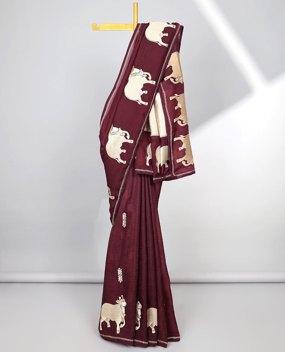 Borderless green crushed tissue saree with buttas & pichwai cow buttas, intricate pallu