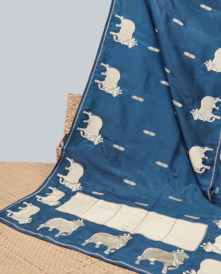 Borderless green crushed tissue saree with buttas & pichwai cow buttas, intricate pallu