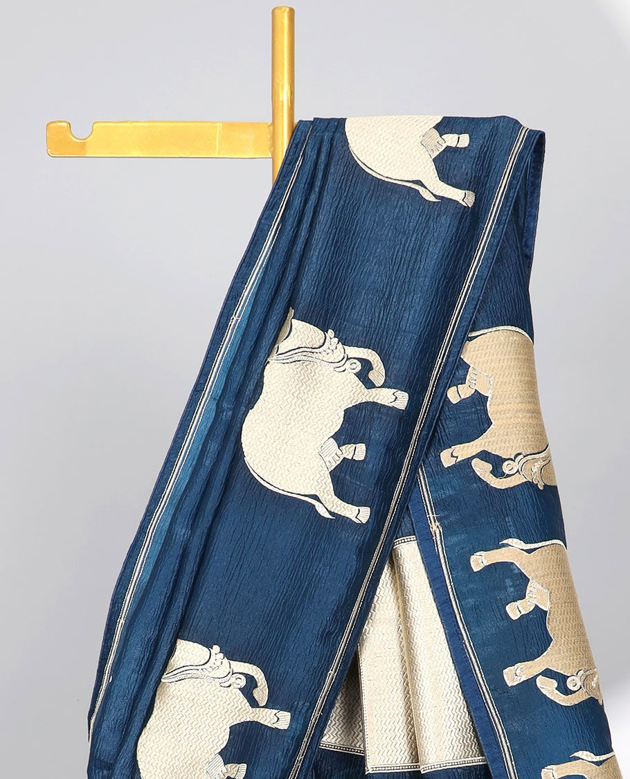 Borderless green crushed tissue saree with buttas & pichwai cow buttas, intricate pallu
