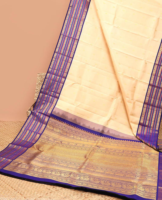 Cream zari buttas silk saree, contrast korvai border of mayil,chakram & neli kodi & intricate pallu