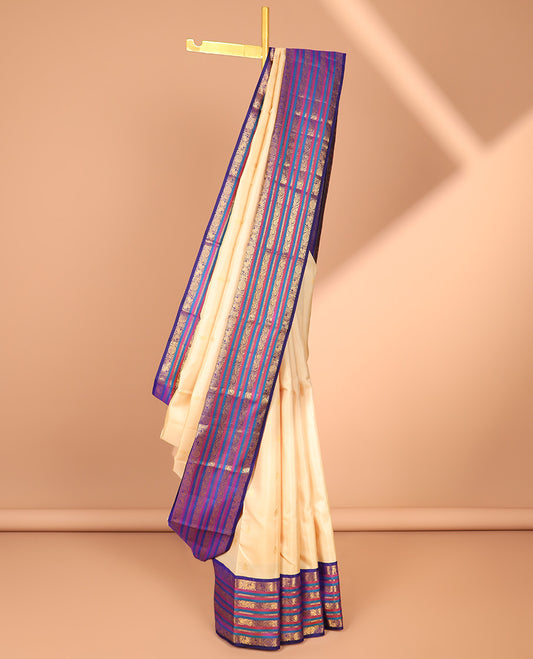 Cream zari buttas silk saree, contrast korvai border of mayil,chakram & neli kodi & intricate pallu