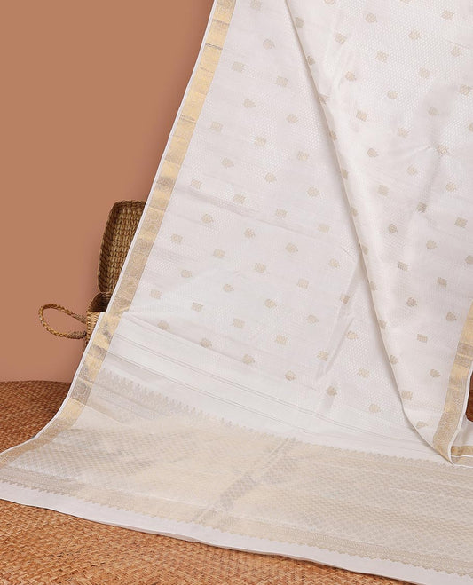 Cream embossed silk saree with zari buttas, kodi visiry zari border & jaal pallu
