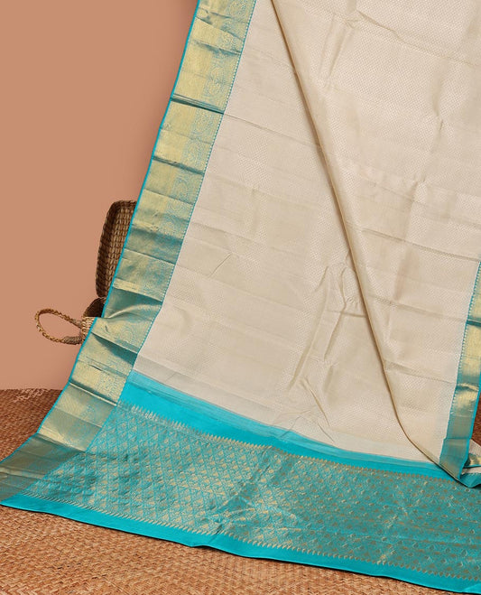Cream embossed silk saree, contrast zari border of traditional designs & jaal pallu