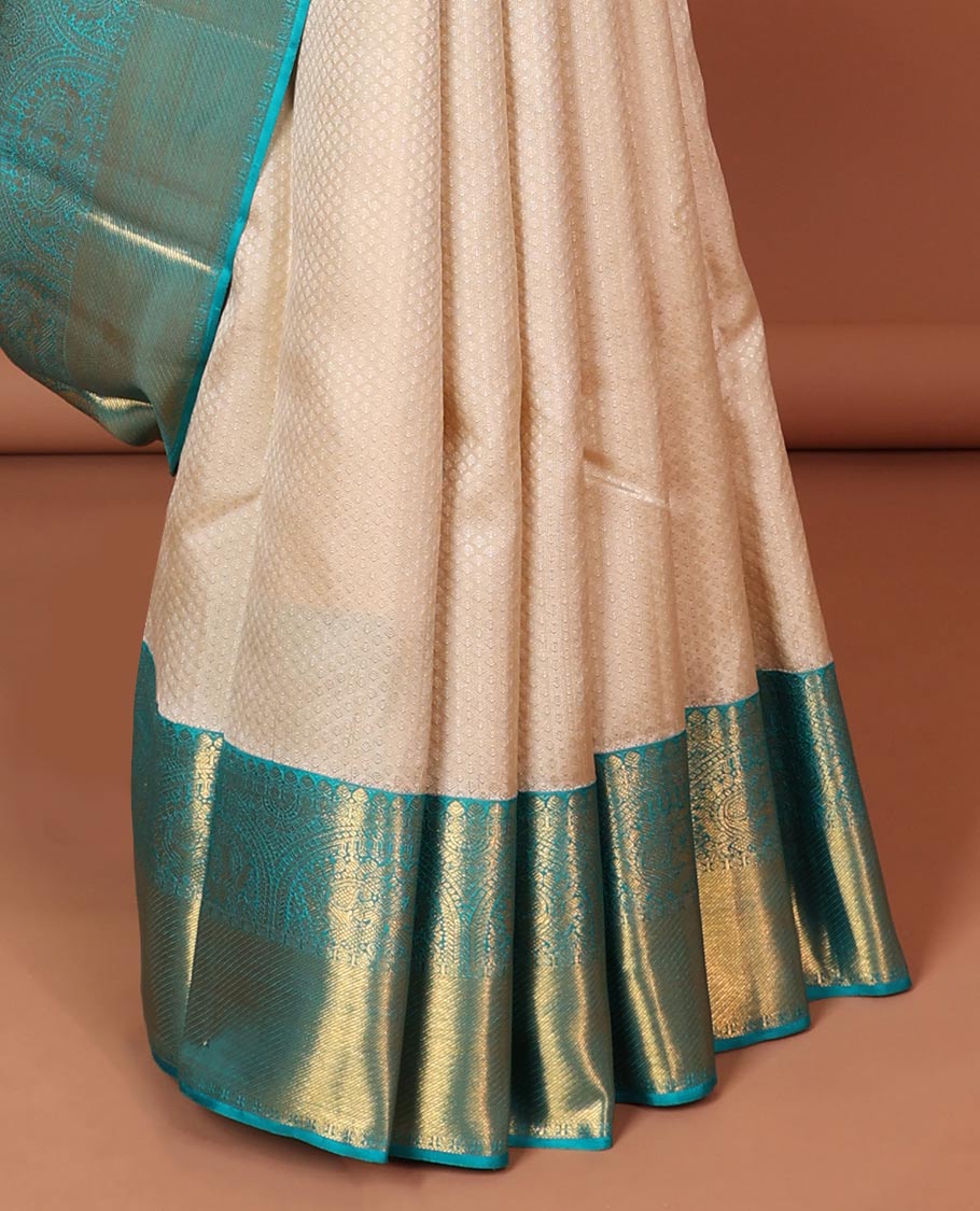 Cream embossed silk saree, contrast zari border of traditional designs & jaal pallu