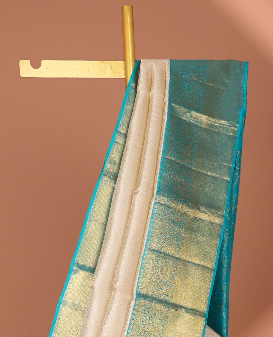 Cream embossed silk saree, contrast zari border of traditional designs & jaal pallu