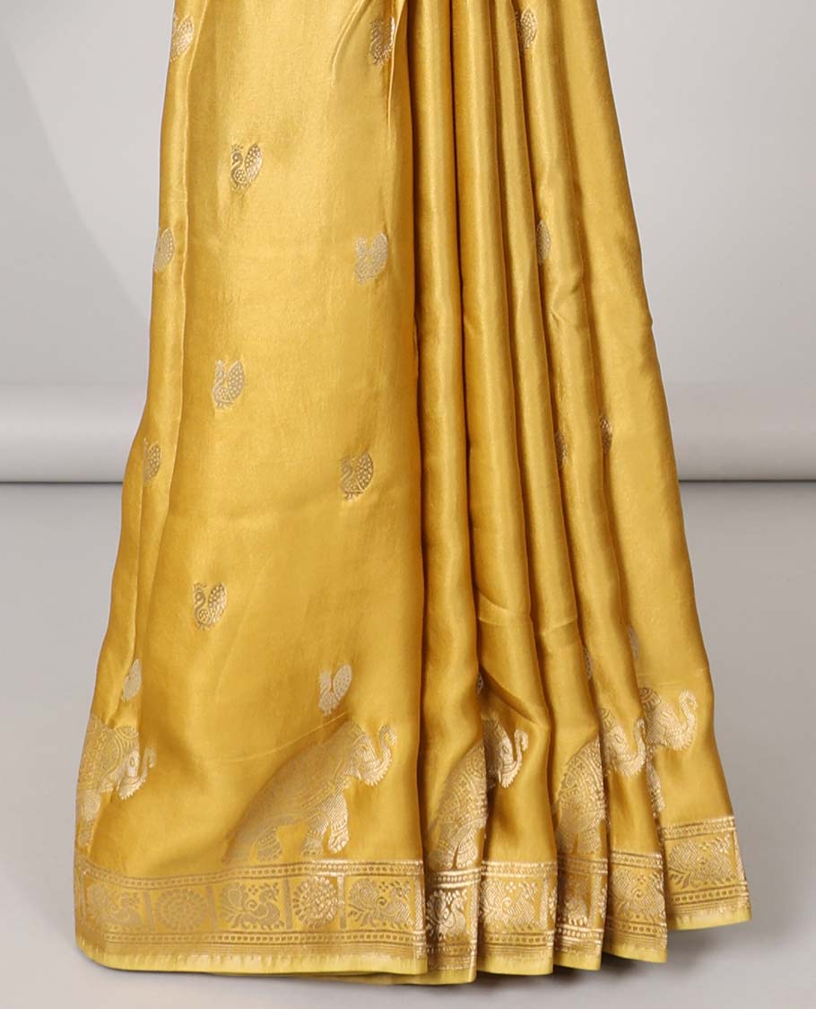 Mustard mushru silk saree with buttas, peacock & chakram border & floral creeper pallu
