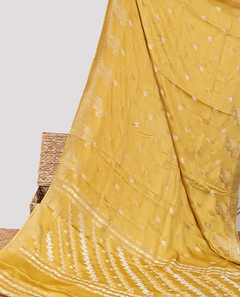 Mustard mushru silk saree with buttas, peacock & chakram border & floral creeper pallu