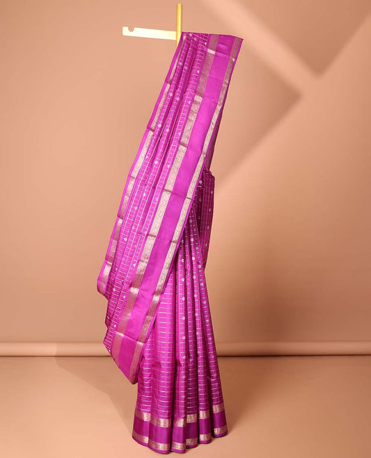 Pink checked & buttas silk saree, zari border features thilakam mokku, kodi mayil & yaanai designs