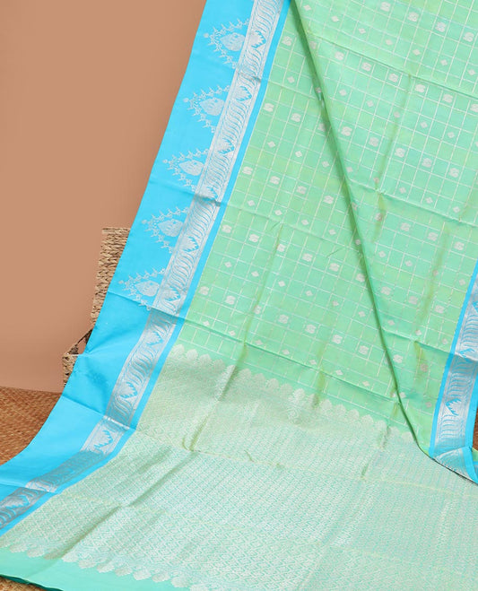 Green buttas enclosed checked Vengatagiri silk saree, contrast zari design border & pallu of jaal designs 