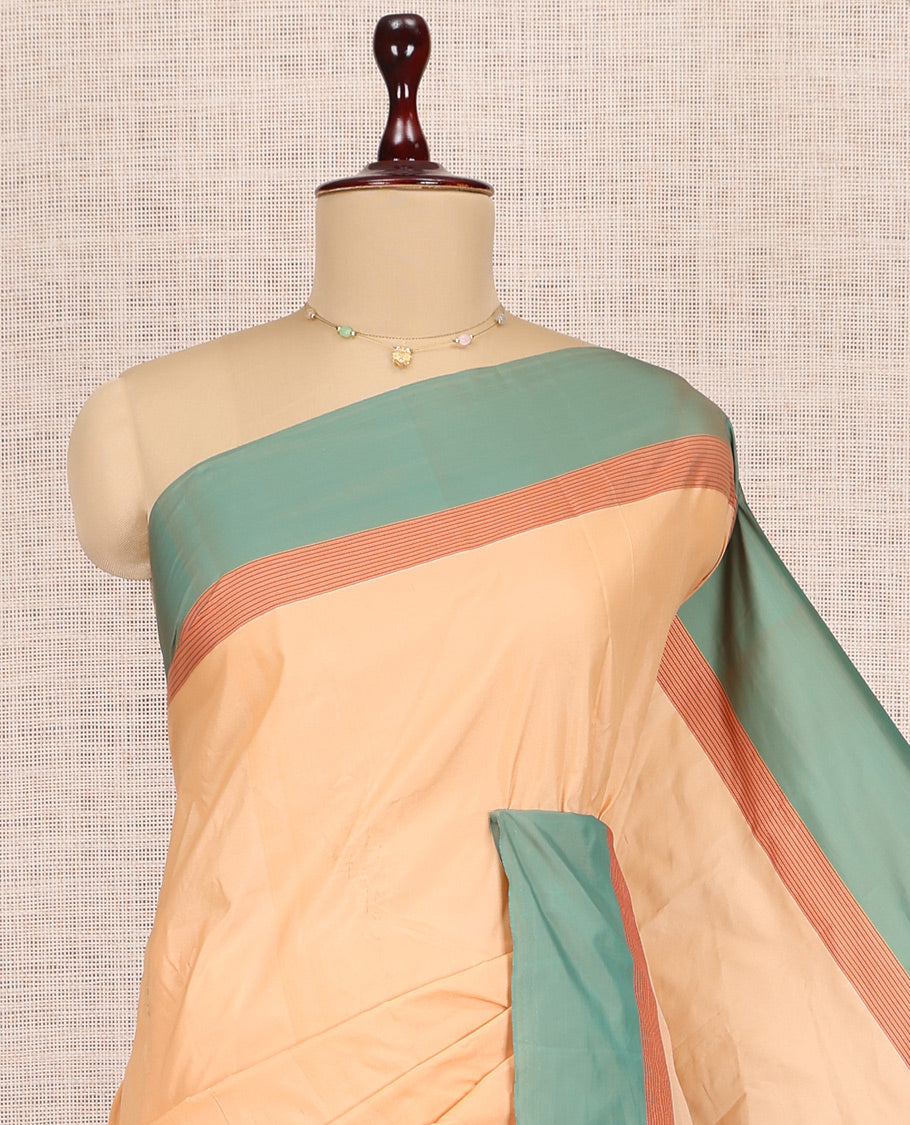 Orange Plain Arani Saree, a Contrast Border, Striped Pallu, and a Contrast Blouse
