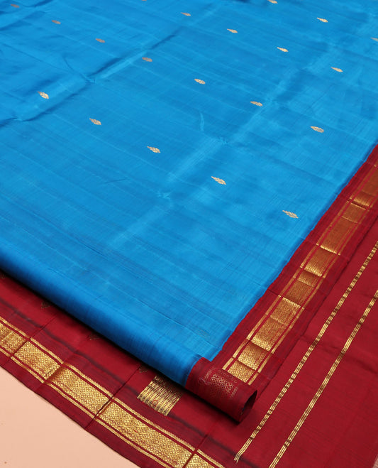 Blue Kanchipuram Silk Saree, Detailed with Zari Buttas, Complemented by a Contrast One-Sided Korvai Border of Banaras and Jaal Designs, Grand Pallu, and No Blouse