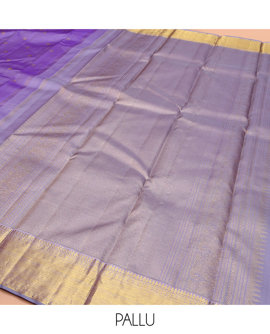 Lavender Kanchipuram Silk Saree, Ornamented with Zari Buttas All Over Its Body, Highlighted by Zari Border of Thilakam Mokku, Poun, and Kathir Designs, Gleaming Pallu, and Paired with a Matching Blouse