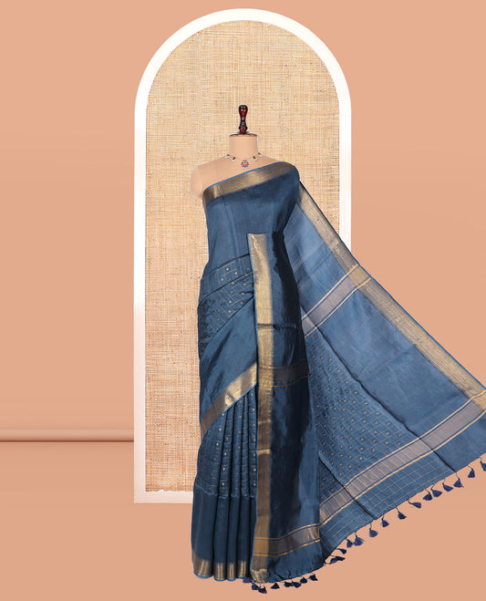 Blue Banana Pith Saree, Gleamed Up with Checks and Buttas, a Zari Temple Border, Striped Pallu, and Matching Blouse