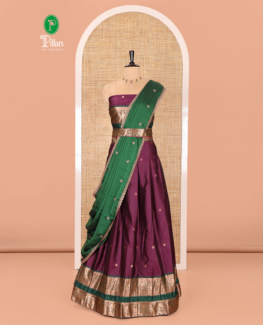 Purple-Green Semi-Banarasi Half-Saree Featuring Zari Buttas on Its Skirt, Complemented by a Contrast Traditional Zari Temple Rettai Pettu Border, Paired with a Matching Blouse, and a Satin Georgette Embroidered Scallop Dhavani