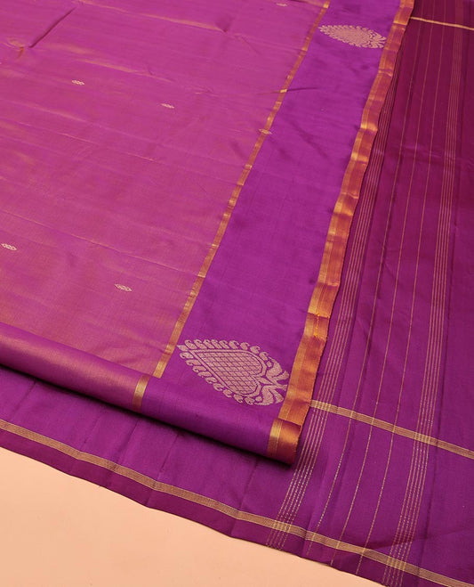 Purple Kanchipuram Silk Saree, Embellished with Zari Buttas All Over Its Body, Complemented by a Contrast Border of Zari Designs, Intricate Motifs Woven Pallu, and Paired with a Contrast Blouse
