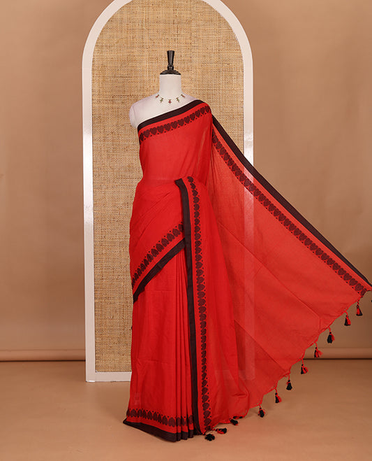 Red plain khadi cotton saree with contrast border and plain pallu with tussels