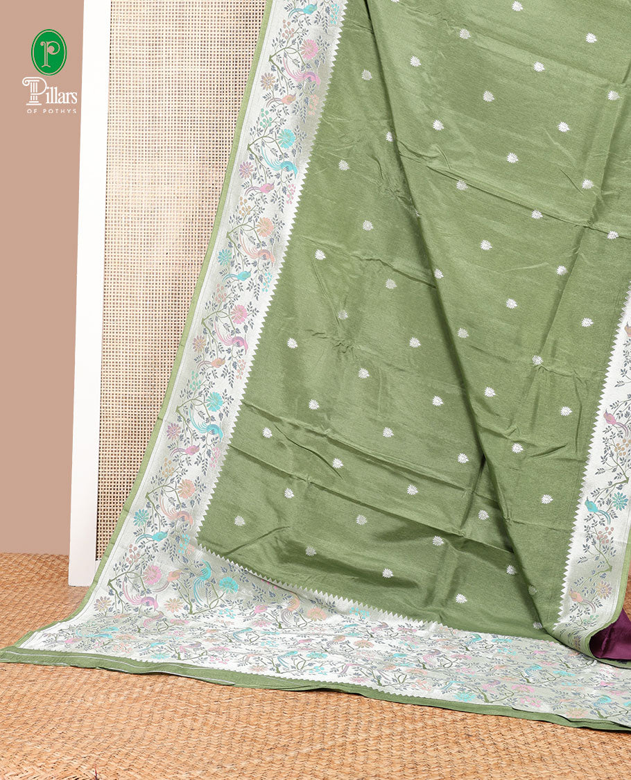 Olive green pathick style design dola silk saree with parrot design border & pathick style pallu along with contrast blouse