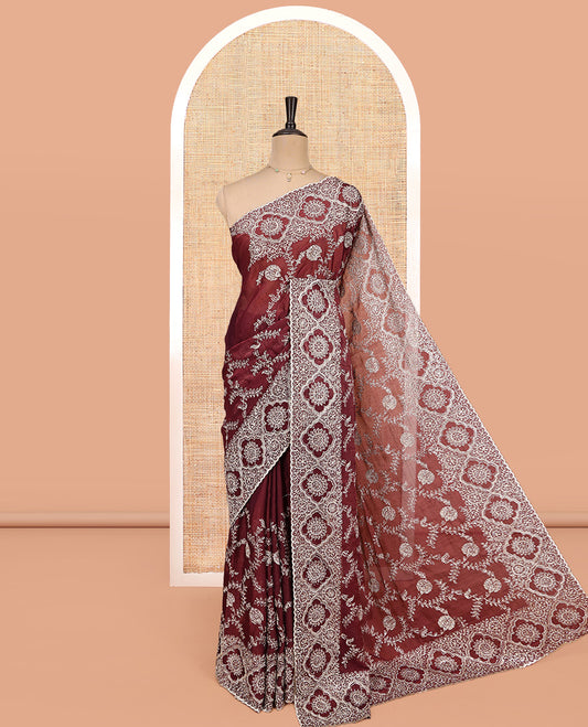 Wine Designer Saree, Decked Up with Floral Embroidered All Over Its Body, a Scallop Embroidered Border, and Matching Blouse