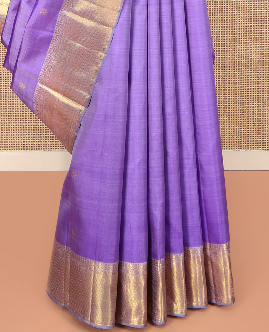 Lavender Kanchipuram Silk Saree, Ornamented with Zari Buttas All Over Its Body, Highlighted by Zari Border of Thilakam Mokku, Poun, and Kathir Designs, Gleaming Pallu, and Paired with a Matching Blouse