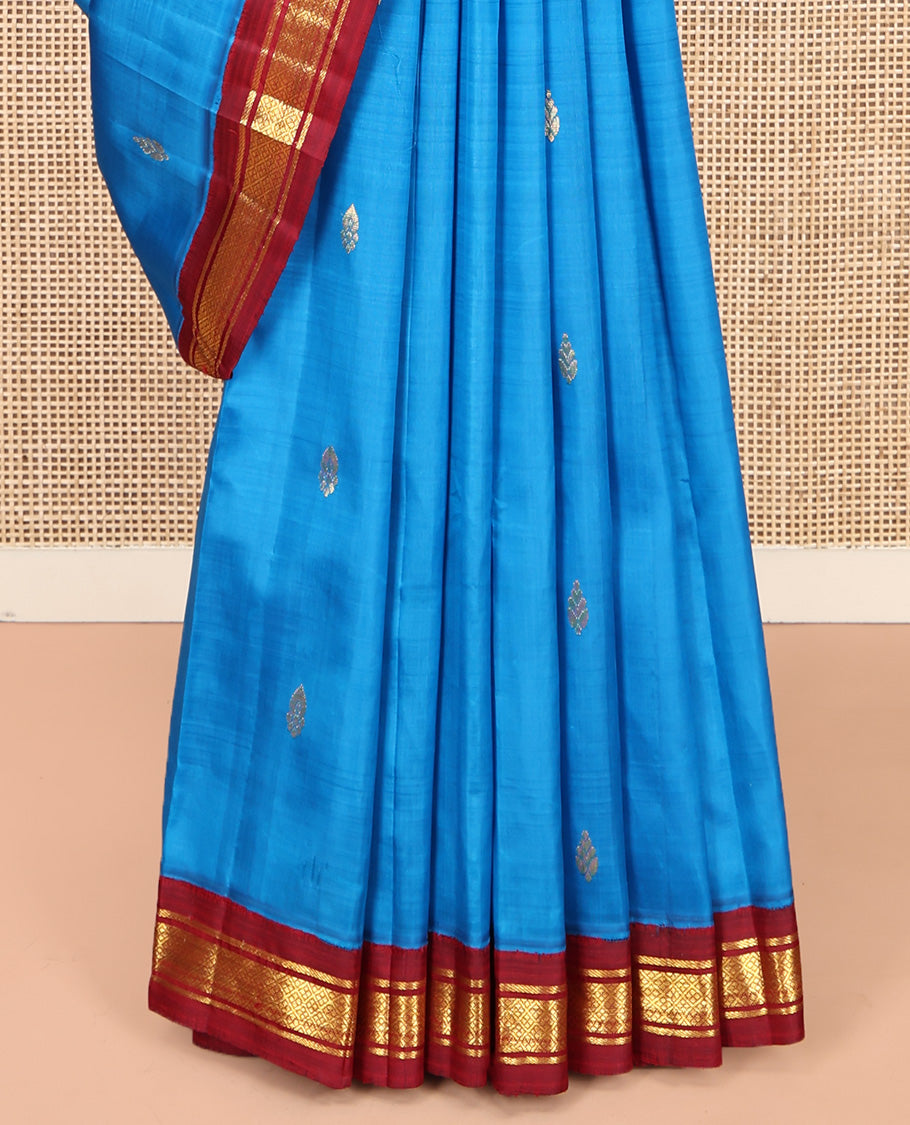 Blue Kanchipuram Silk Saree, Detailed with Zari Buttas, Complemented by a Contrast One-Sided Korvai Border of Banaras and Jaal Designs, Grand Pallu, and No Blouse