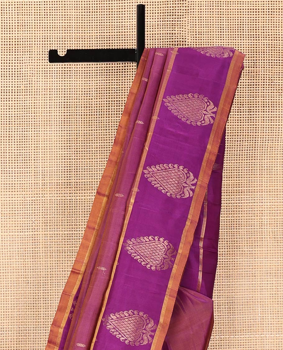 Purple Kanchipuram Silk Saree, Embellished with Zari Buttas All Over Its Body, Complemented by a Contrast Border of Zari Designs, Intricate Motifs Woven Pallu, and Paired with a Contrast Blouse