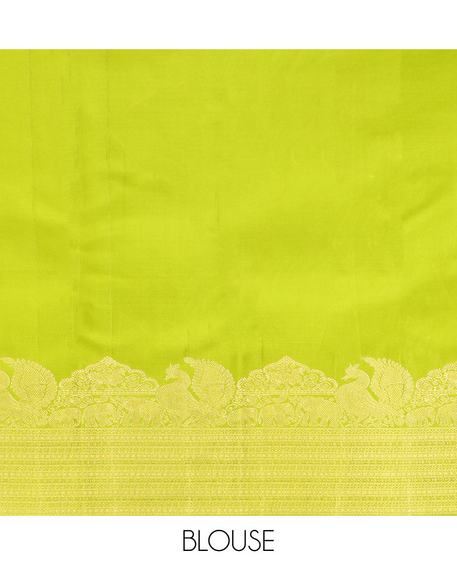 Parrot Green Kanchipuram Silk Saree, Gleamed Up with Zari Buttas All Over Its Body, Highlighted by a Zari Border of Mayil, Yaanai, and Neli Designs, Intricately Designed Pallu, and Paired with a Matching Blouse