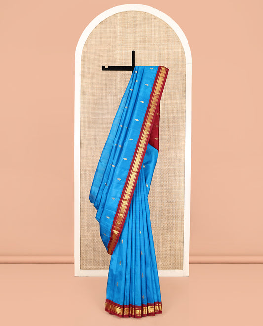 Blue Kanchipuram Silk Saree, Detailed with Zari Buttas, Complemented by a Contrast One-Sided Korvai Border of Banaras and Jaal Designs, Grand Pallu, and No Blouse