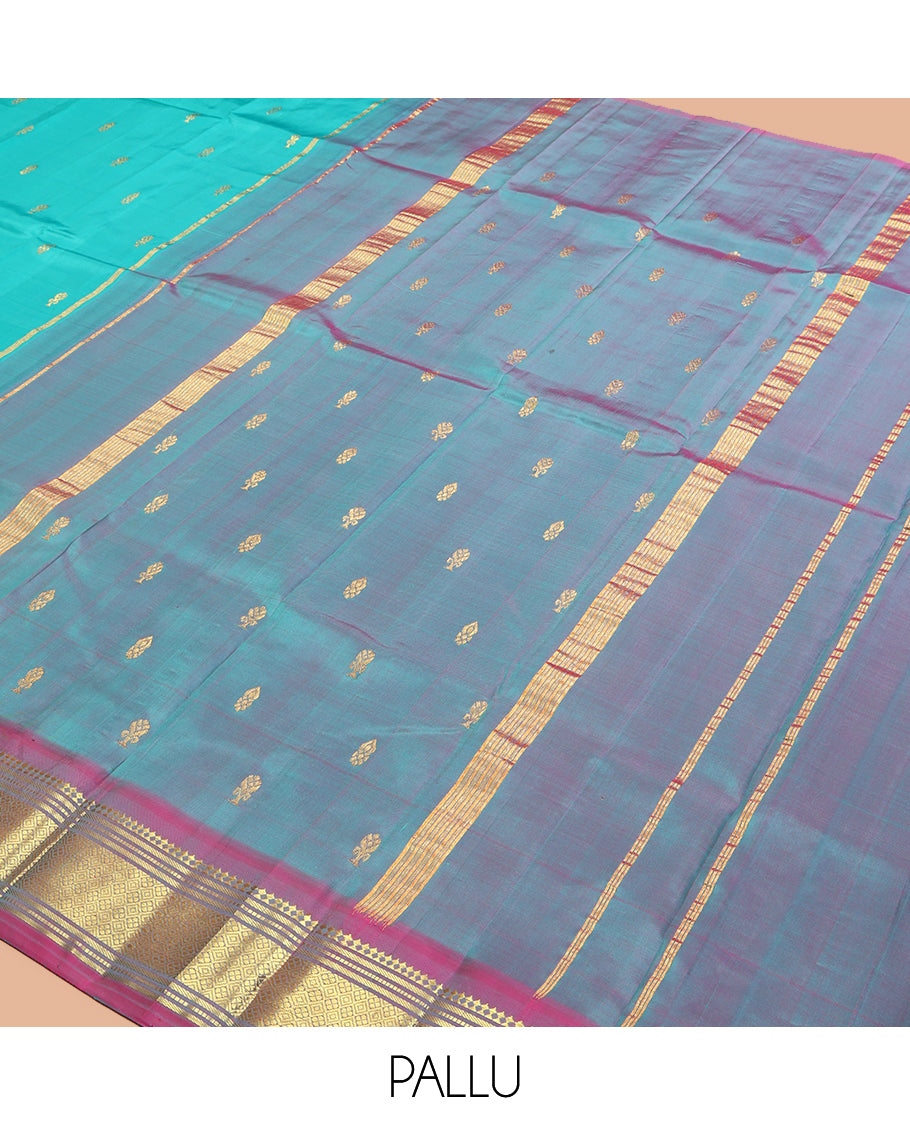 Blue Kanchipuram Silk Saree, Ornamented with Zari Buttas, a Contrast One-Sided Border of Paneer Sombu, Banaras, Muthu and Jaal Design, Zari Design Pallu, and No Blouse