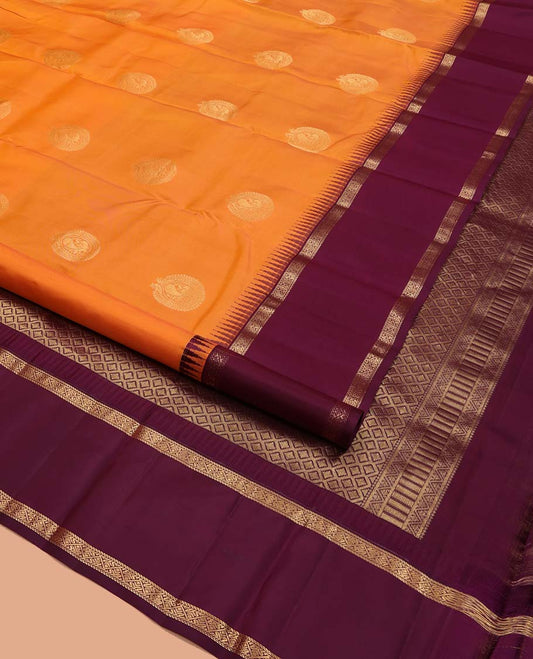 Orange Vasundhara Silk Saree, Delicately Woven with Zari Buttas All Over Its Body, Complemented by a Contrast Rettai Pettu Temple Border of Zari Designs, Grand Jaal Pallu, and Paired with a Contrast Blouse