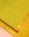 Green Kanchipuram Silk Saree, Accentuated with Zari Buttas, a Contrast One-Sided Border of Banaras, Muthu, and Mayil Kannu, Zari Design Pallu, and No Blouse