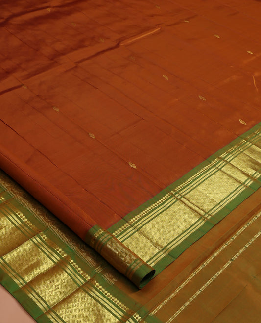 Brown Kanchipuram Silk Saree, Beautified with Zari Buttas, a Contrast One-sided Border of Panner Sombu, Banaras, and Jaal Designs, Pallu of Floral Designs, and No Blouse