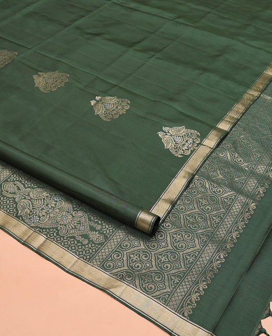 Green Mayuri Soft Silk Saree, Entralled with Zari Buttas All Over Its Body Highlighted iby Zari Piping Border, Intricately Designed Pallu and Paired with a Matching Blouse