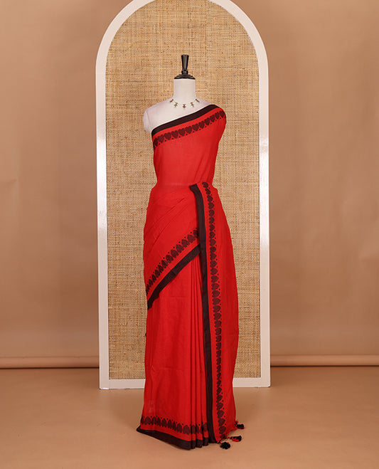 Red plain khadi cotton saree with contrast border and plain pallu with tussels