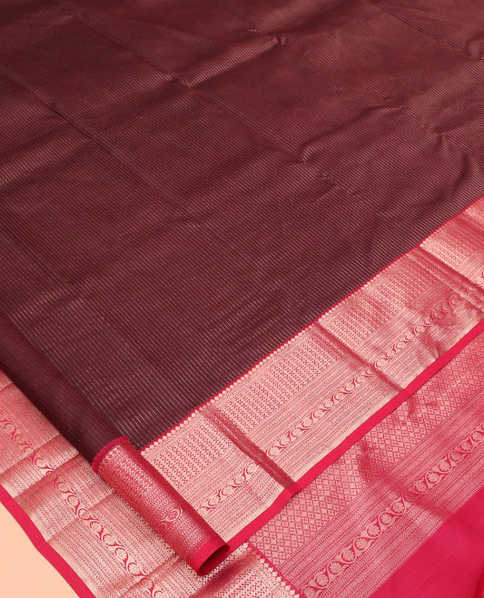 Maroon Vasundhara Silk Saree, Gleamed Up with Vaira Oosi Stripes, a Contrast Border of Thilakam Mokku, Muthu, Rettai Neli, Kathir, and Kodi Visiry Designs, Grand Pallu, and a Contrast Blouse