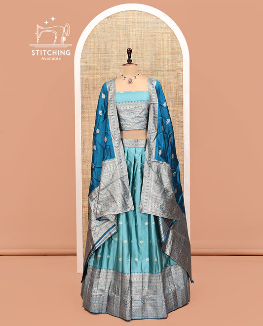 Blue Art Silk Half Saree, Embellished with Buttas Skirt, Contrast Traditional Border, Matching Blouse, and a Contrast Banaras Dhavani