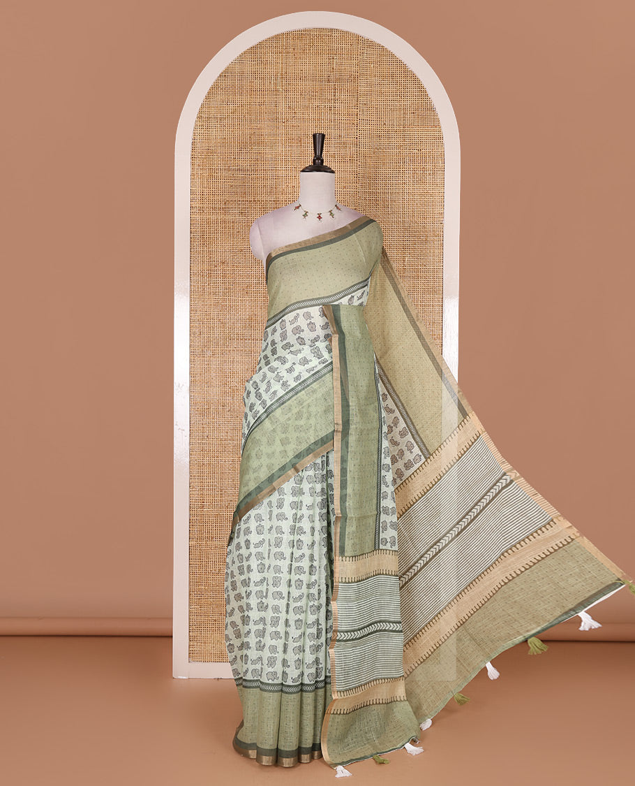 Green cute elephant motifs printed linen cotton saree, contrast chevron border, pallu of stripes and chevron, and contrast printed blouse