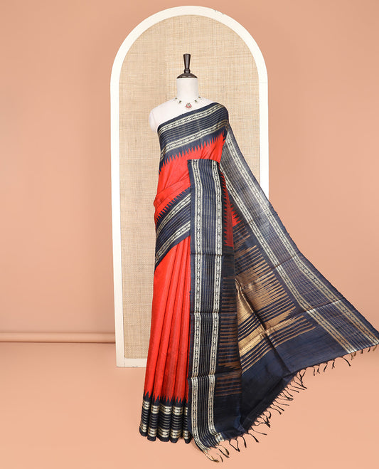 Orange Plain Dupion Silk Saree, Decked Up with Contrast Temple Border of Geometric Patterns in Thread Weave, Pallu Depicting Temple Designs, and Paired with a Contrast Blouse