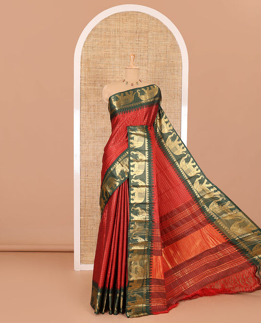 Maroon zari checked semi-taffeta saree, contrast satin temple border of elephant motifs, striped pallu, and a contrast striped blouse