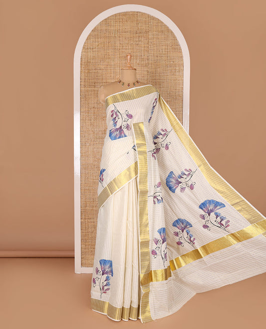 Cream and blue vertically striped with handblock floral motifs printed Kerala cotton saree, zari striped border, handblock floral printed pallu, and a matching blouse