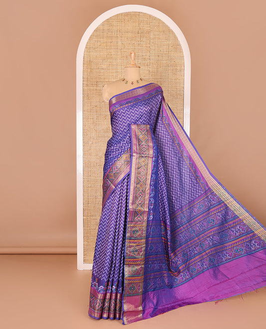 Blue chevron striped patola saree, contrast traditional zari and patola printed border, patola printed pallu, and a contrast blouse
