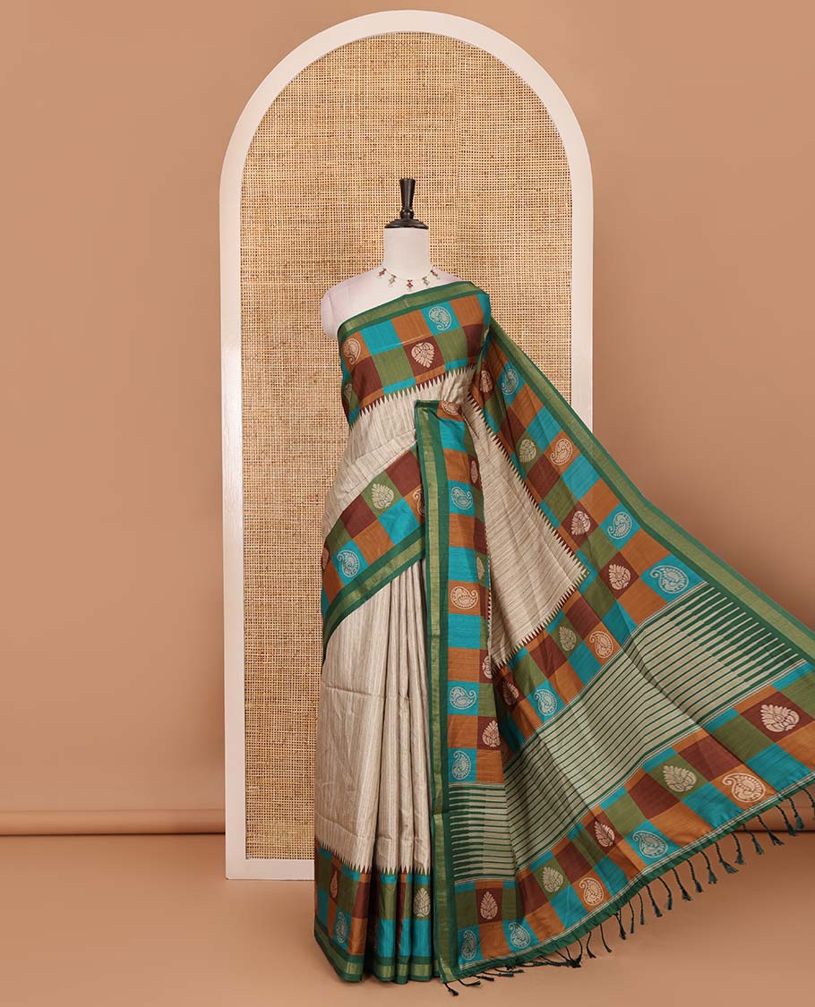 Chikku-Green plain kathan silk saree, contrast buttas enclosed multi-color checked blocks border, temple pallu, and contrast blouse of checks, and buttas