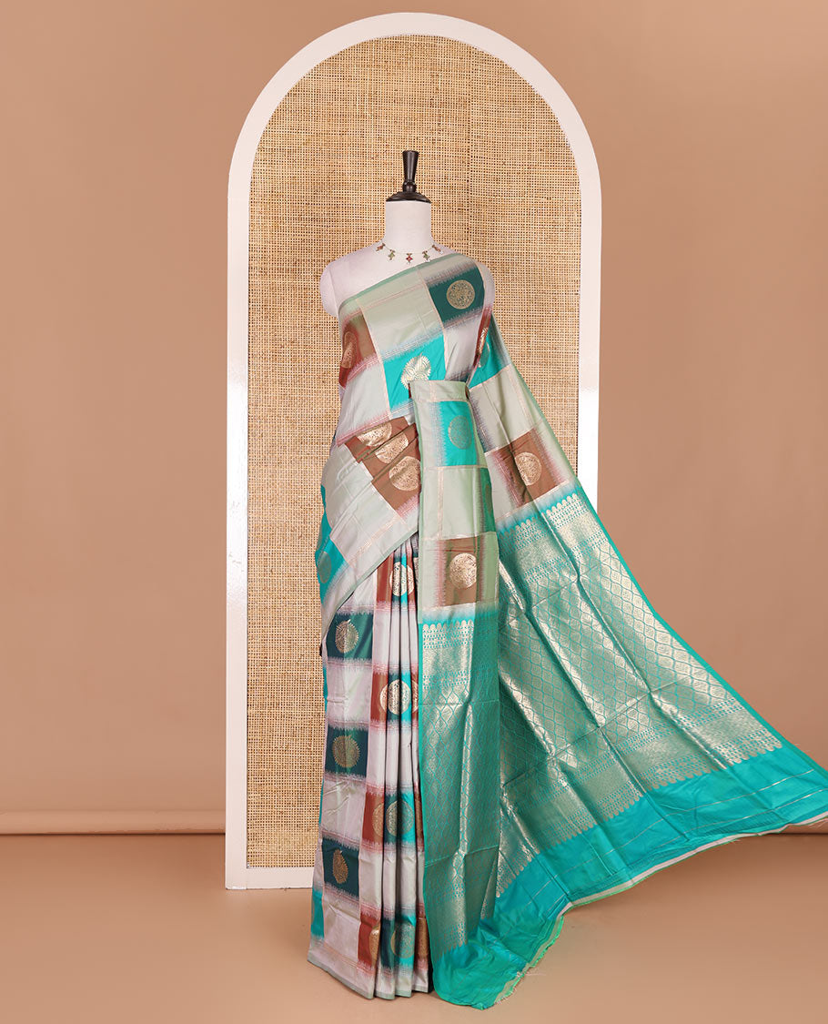 Borderless pista green chakra buttas enclosed, checked elite soft silk saree, contrast ogee patterned pallu, and contrast zari design blouse