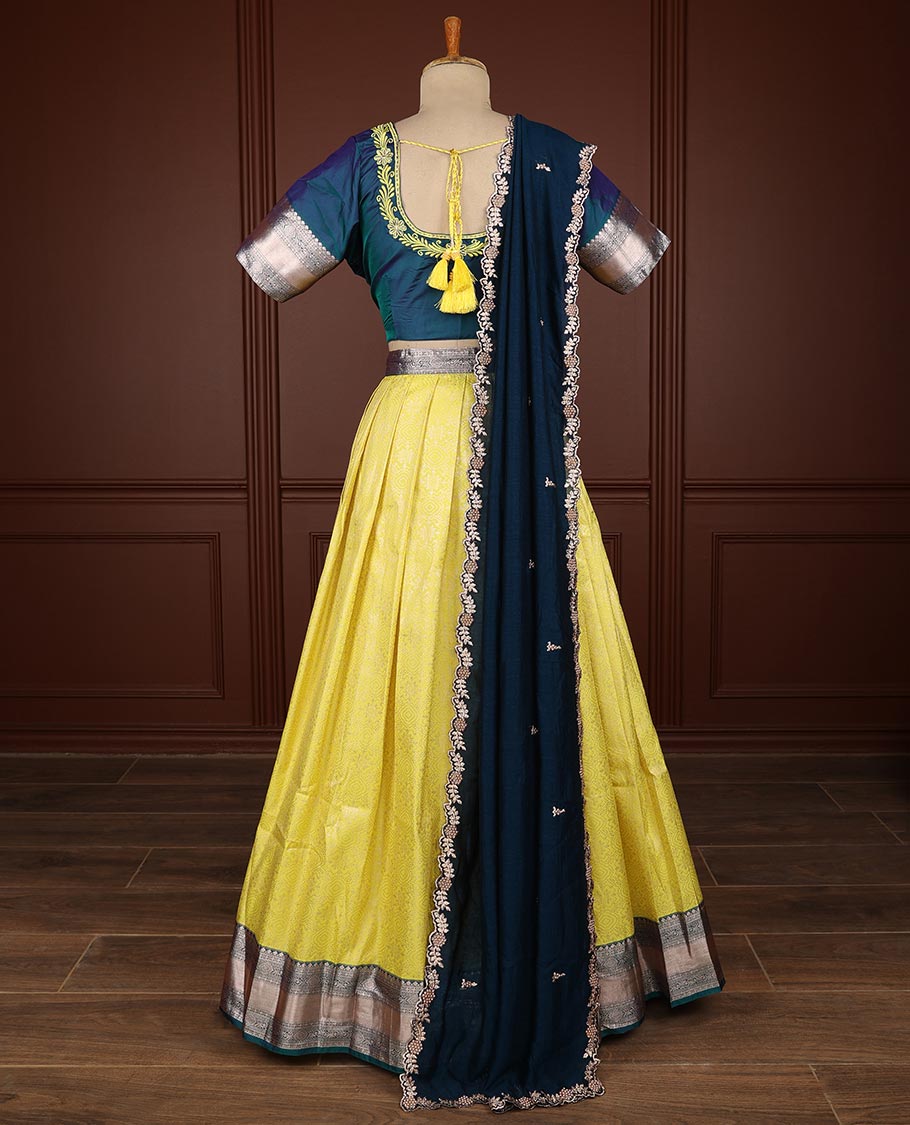 Yellow geometric design half saree witn contrast zari design border, floral embroidery blouse & floral embroidery dhavani