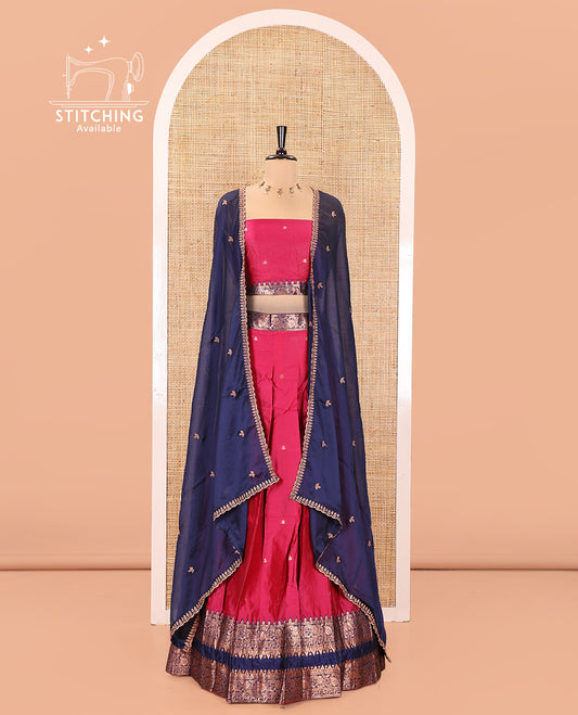 Pink and Blue Semi-Banarasi Half-Saree, Accentuated with Zari Buttas on Its Skirt, Complemented by a Contrast Rettai Pettu Traditional Zari-Design Border, Paired with a Matching Blouse, and Comes with a Contrast Satin Georgette Embroidered Dhavani