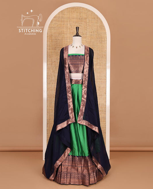 Green taffeta silk half saree, plain with contrast navy blue traditional zari big border, matching zari blouse, and contrast plain zari border dhavani