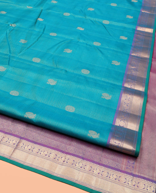 Blue Vasundhara Silk Saree, Embellished with Mayil-Chakra Buttas, Complemented by a Contrast Border of Rekku, Muthu, Kathir, Mayil, Chakram, and Mayil Kann, Jaal Pallu, and a Contrast Blouse
