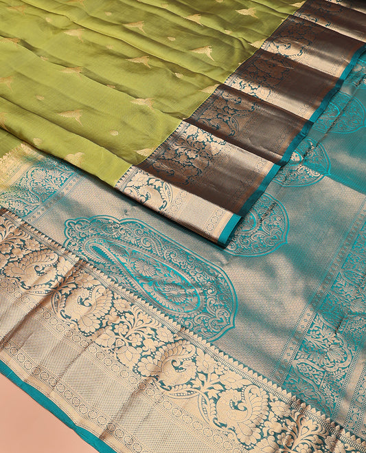 Green zari buttas Vasundhara silk mix saree, contrast border of thilakam mokku, muthu, mayil, laddu kamalam,  and kuyil kann designs, and pallu of paisleys