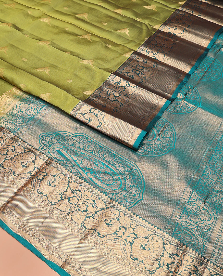 Green zari buttas Vasundhara silk mix saree, contrast border of thilakam mokku, muthu, mayil, laddu kamalam,  and kuyil kann designs, and pallu of paisleys