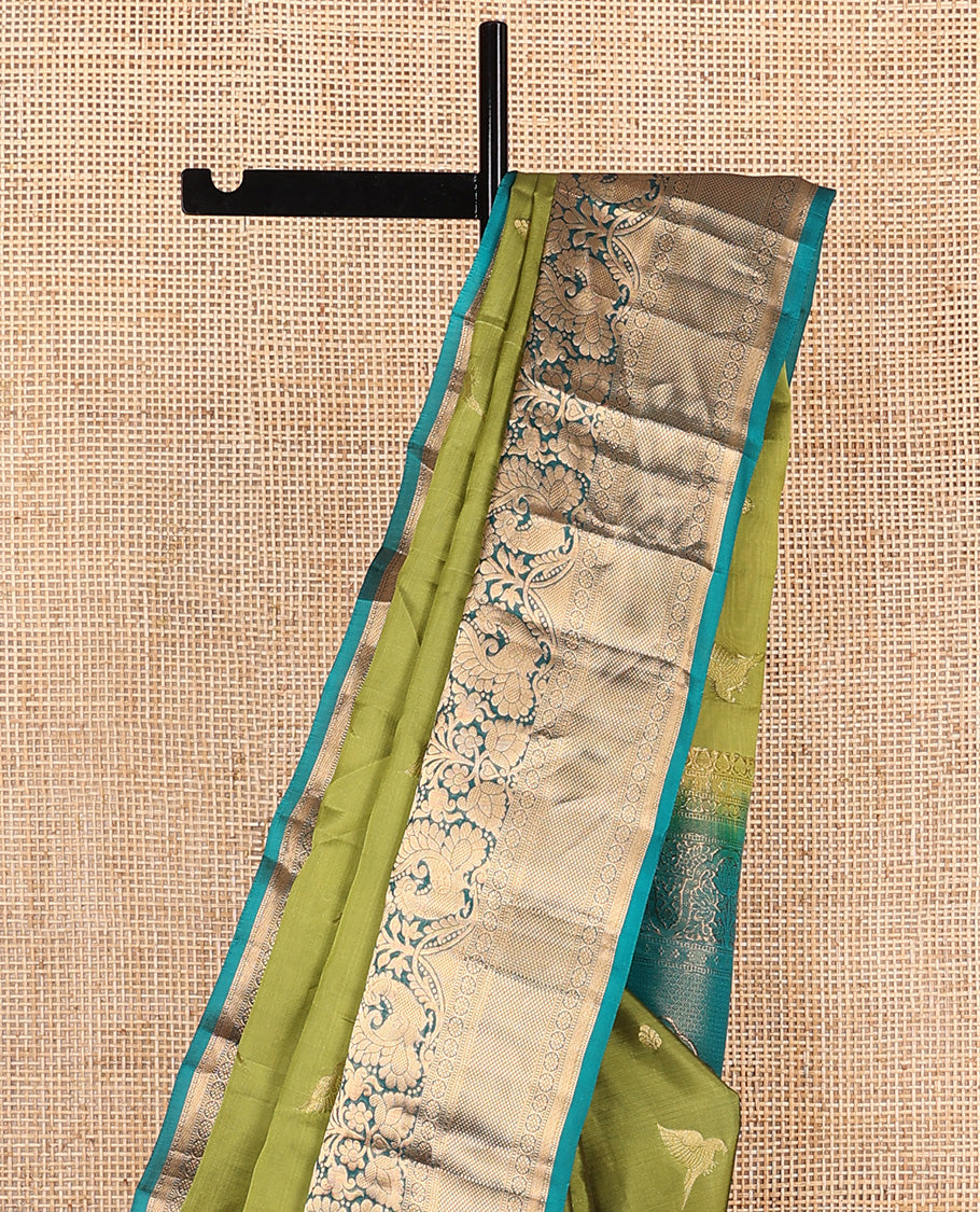 Green zari buttas Vasundhara silk mix saree, contrast border of thilakam mokku, muthu, mayil, laddu kamalam,  and kuyil kann designs, and pallu of paisleys