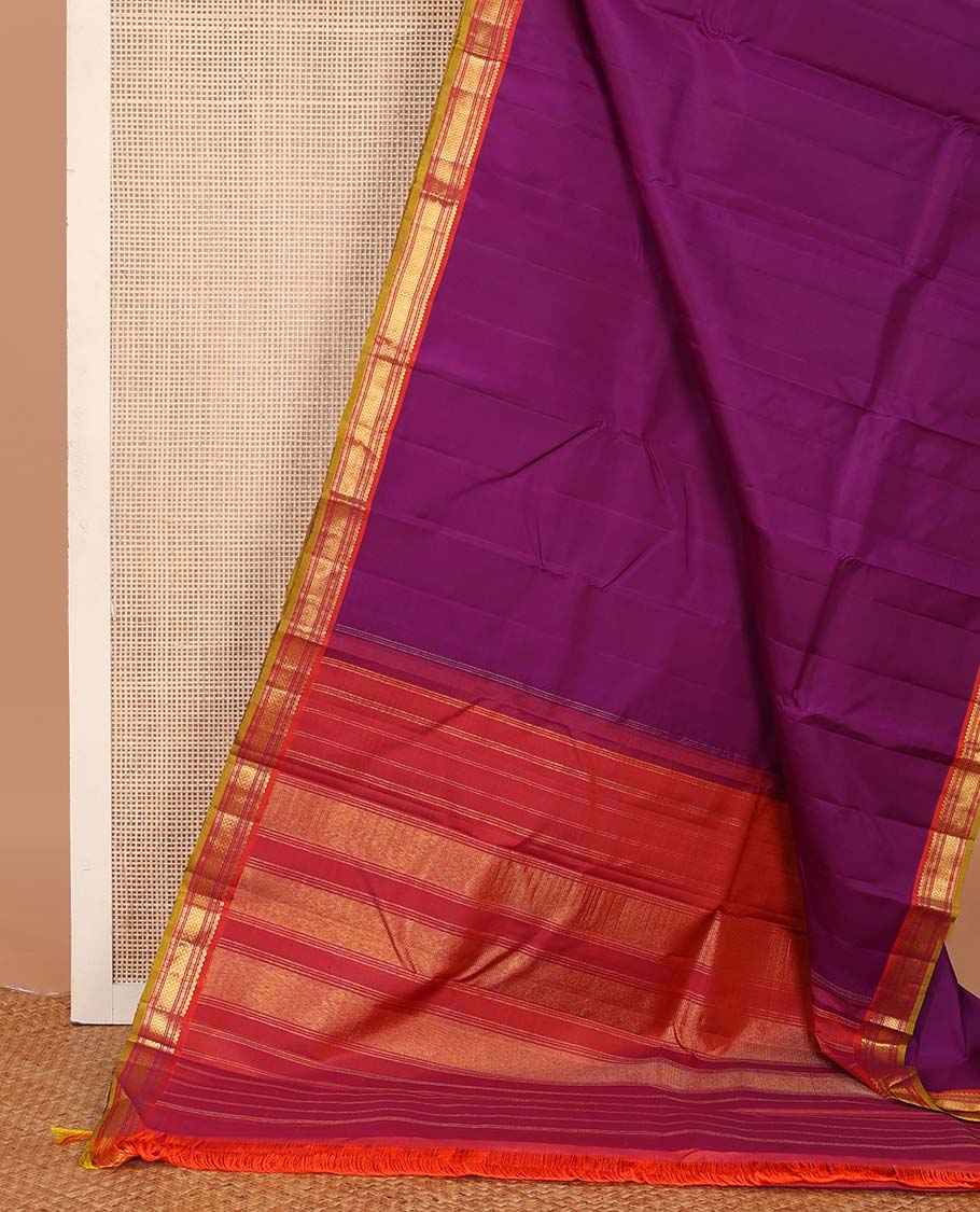 Purple plain Kanchipuram silk saree, contrast border of salngai, muthu, cross kamalam, and vanki designs, and zari design pallu